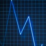 Nighttime reflections on building windows.